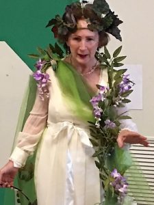 Woman dressed as Mother Nature, speaking to schoolchildren
