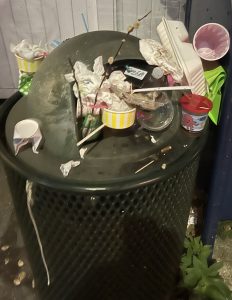 Public trash can overflowing